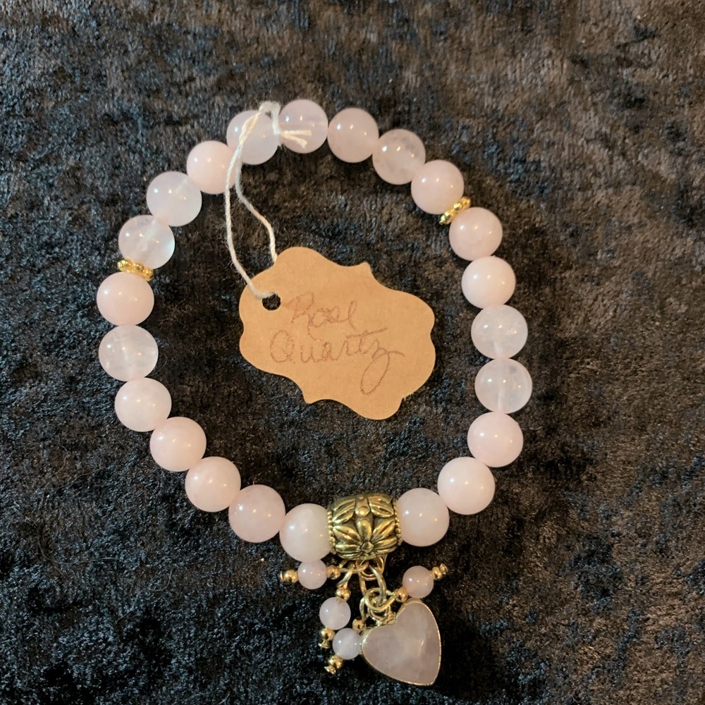 Rose quartz gemstone bead bracelet with dangling charms